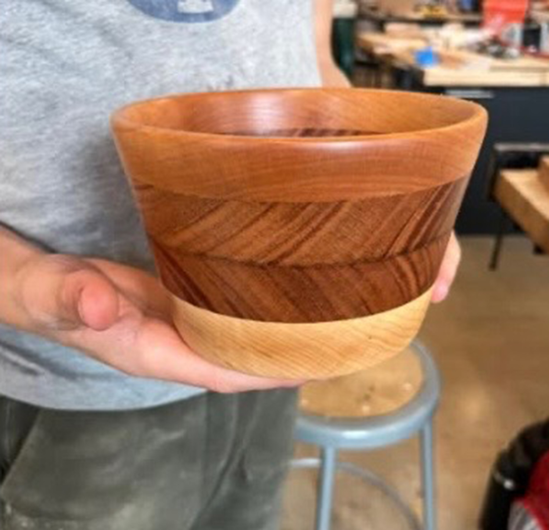 Handcrafted segmented wooden bowl created in a woodturning workshop and displayed by the maker